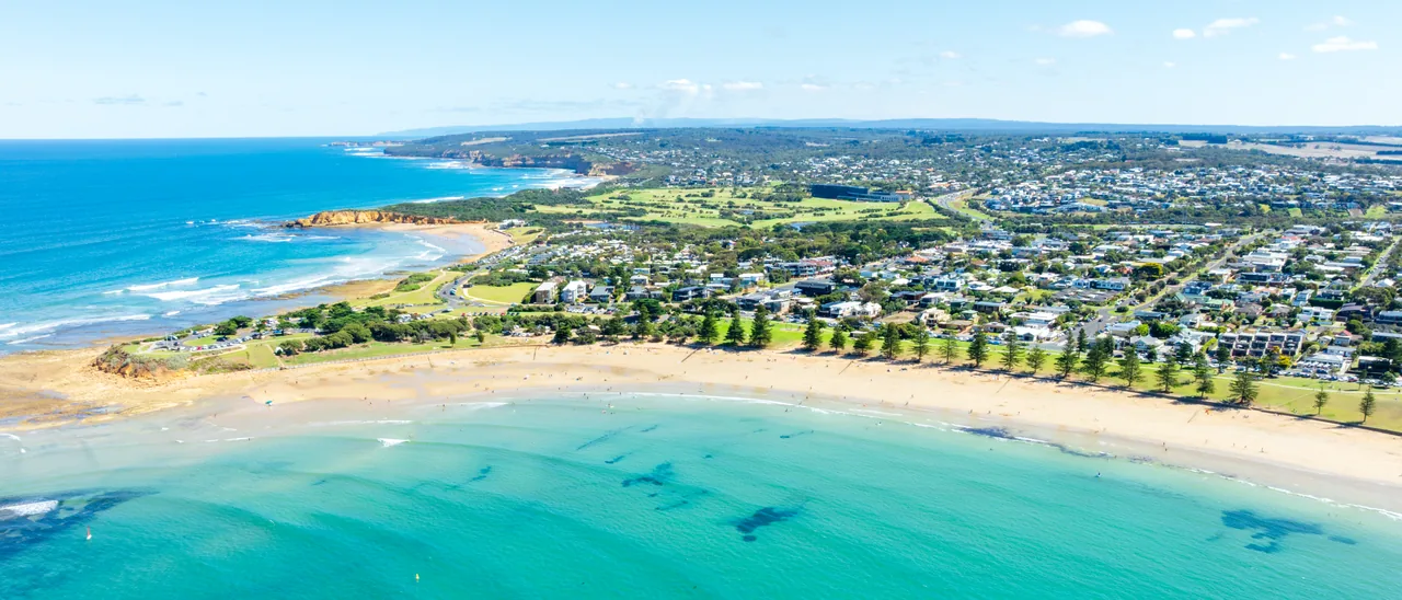 Aerial view of a Surf Coast town and beach